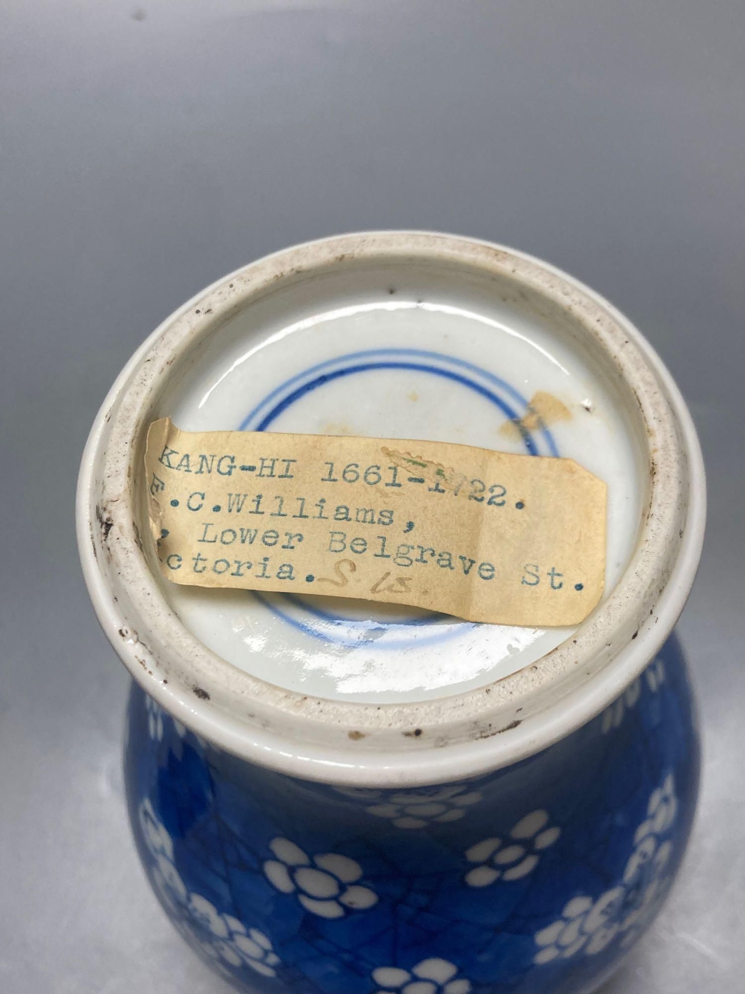 A Chinese blue and white vase, Kangxi period, wood cover, neck reduced, 18cm